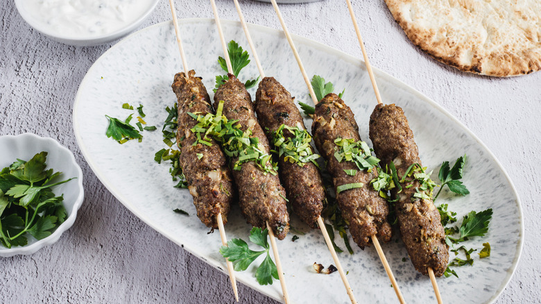 lamb skewers with garnishes