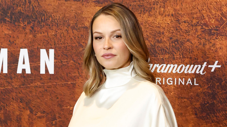 Kayla Wallace posing on red carpet.