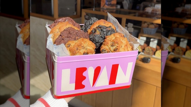Pink Levain Bakery box containing eight cookies in various flavors.
