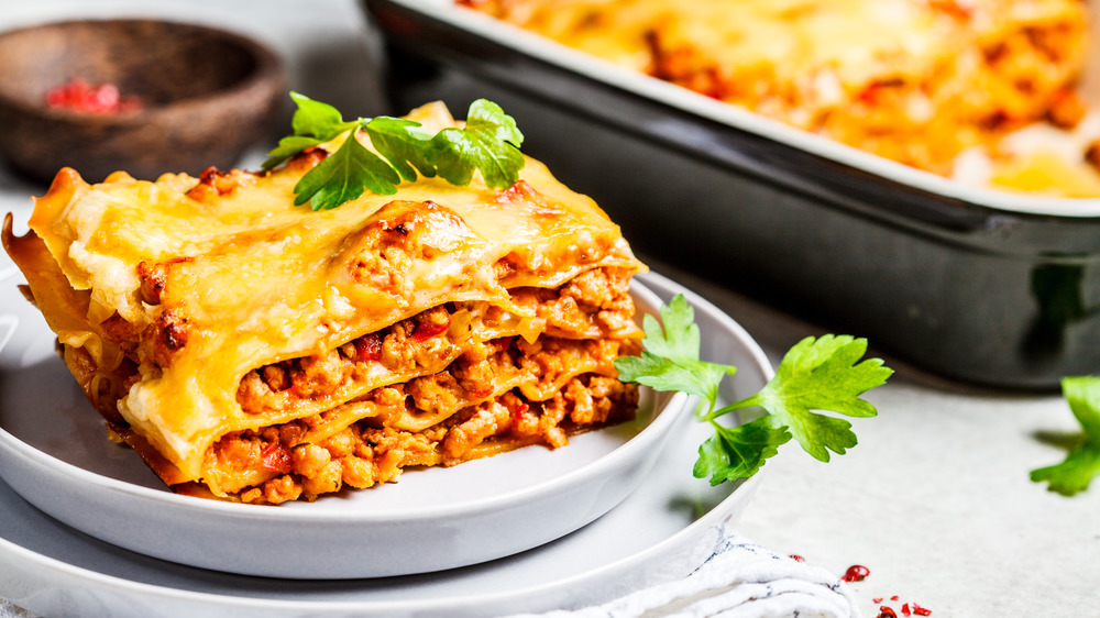 white plate of beef lasagna