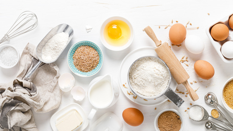 Cake ingredients on white background