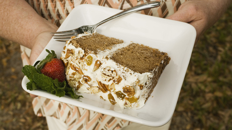 Person holding plate of Lady Baltimore cake