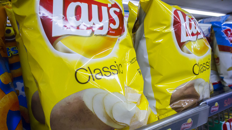 Bags of Lay's potato chips on shelf