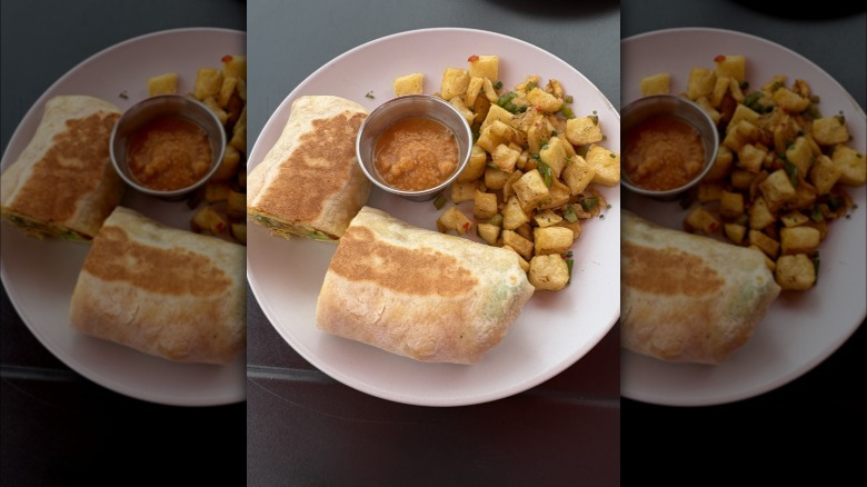 Breakfast burrito with salsa and potatoes