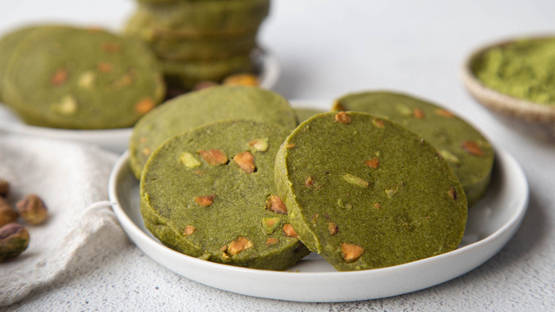 Green cookies on white plate