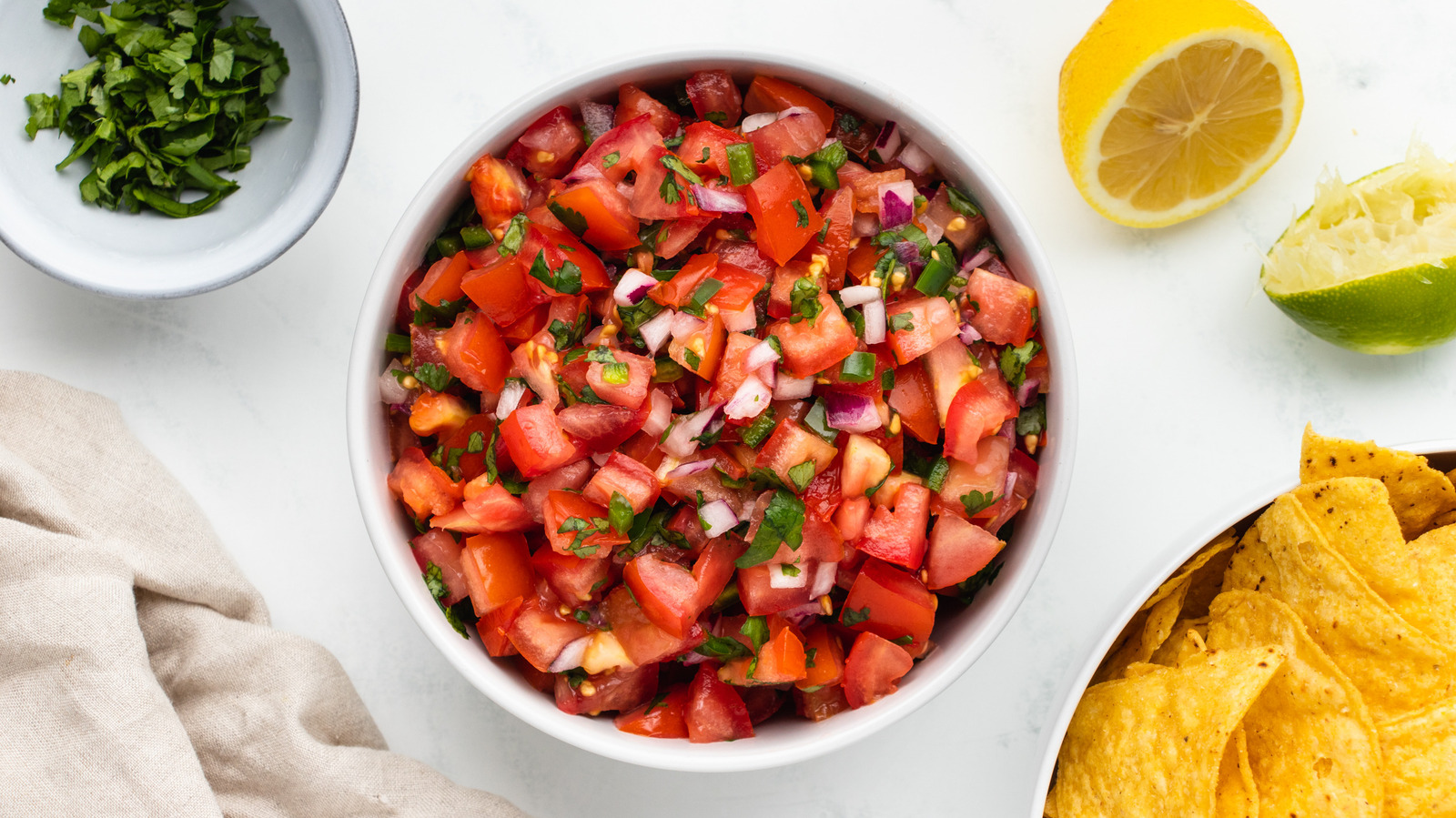 Lemon And Lime Juice Are Essential To Copycat Chipotle Tomato Salsa