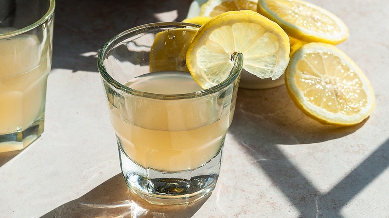 lemon drop shot with lemon wedges