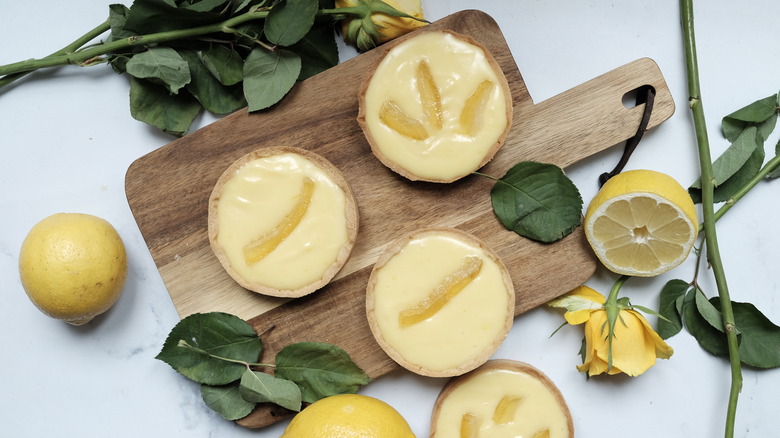 lemon tarts on cutting board