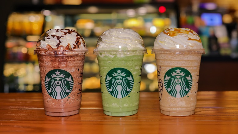 three Starbucks Frappuccinos on table