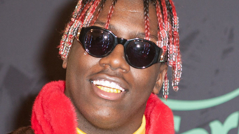 Lil Yachty smiling in sunglasses