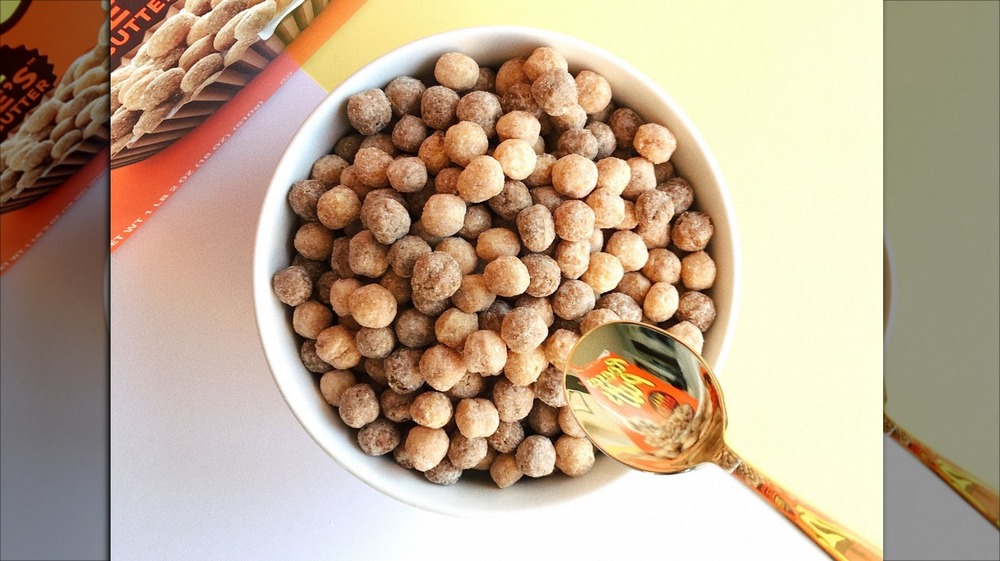 Bowl of Reese's Puffs with logo reflected in spoon