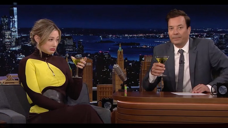 Lili Reinhart and Jimmy Fallon drinking