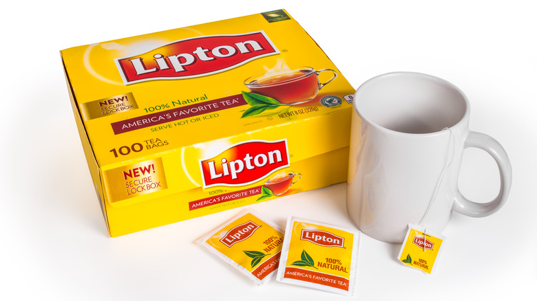 Box of Lipton tea with  bags and mug