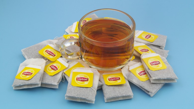 Drink surrounded by teabags