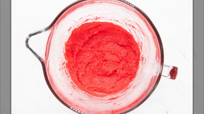 Red dough in glass bowl