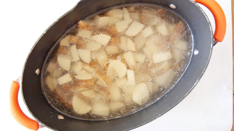 potatoes in pot of water