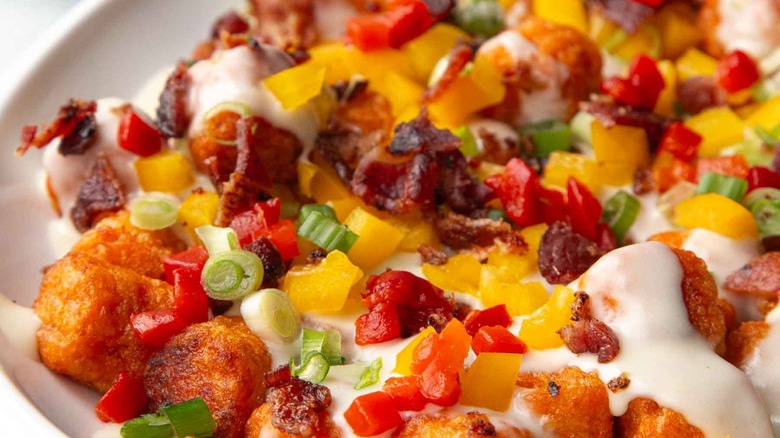 close up of loaded sweet potato tots on plate