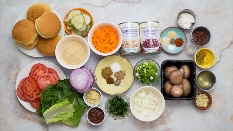 Vegan bean burger and special sauce ingredients on table