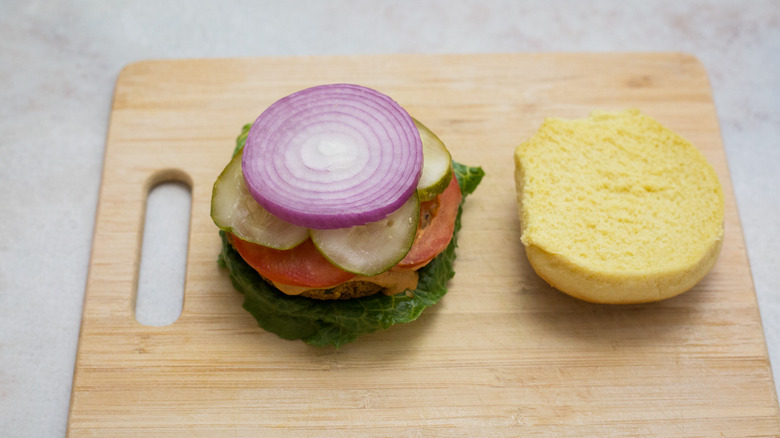 veggie burger on wooden board