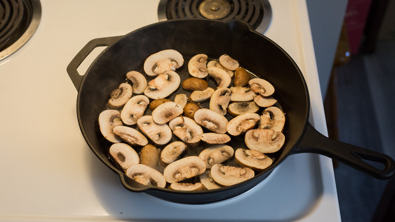 mushrooms cooking in pan
