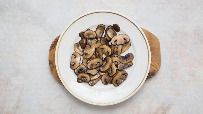 cooked mushrooms on white plate