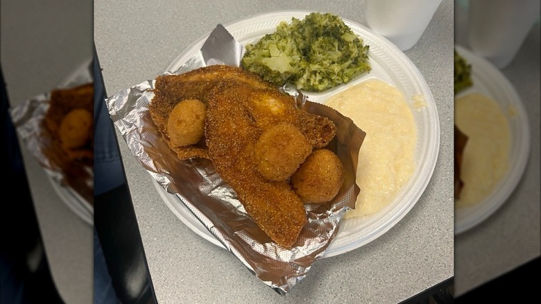 Bonita's fried catfish, hushpuppies, and sides on plate