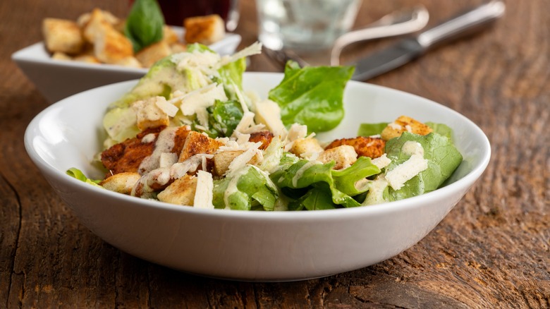 caesar salad on table