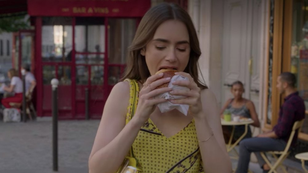 Emily in Paris eating pain au chocolat 