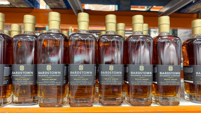 Multiple bottles of Bardstown Bourbon Company bourbon on a shelf.