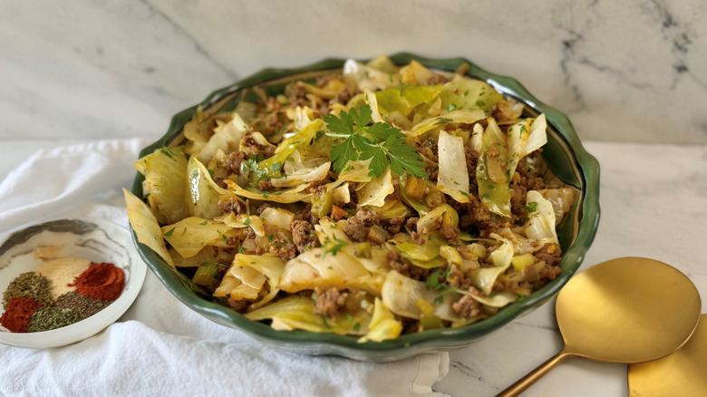 Dirty cabbage in bowl topped with parsley