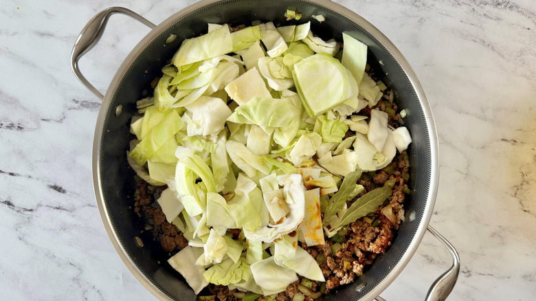 Sliced cabbage in skillet