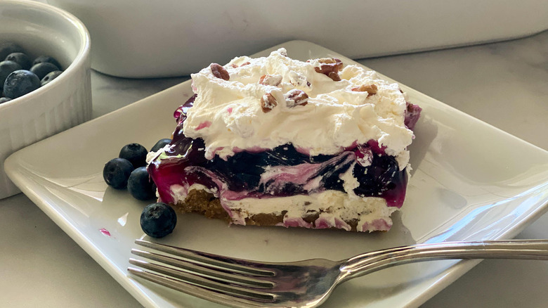 Luscious Layered Blueberry Delight served on a plate