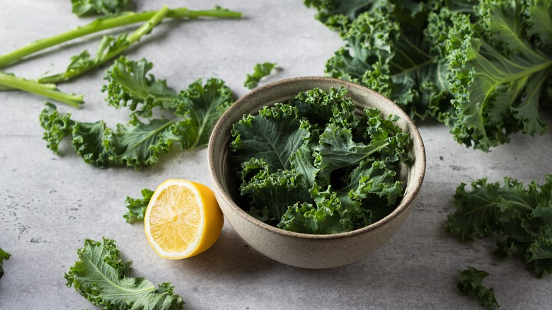 Kale in bowl with a lemon beside it