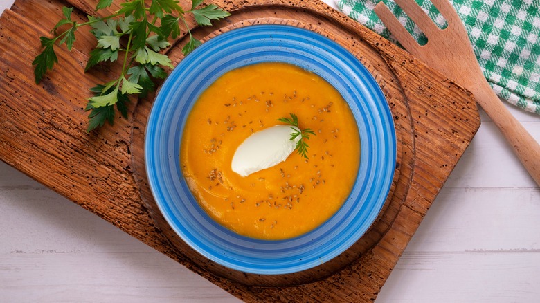 soup with mascarpone cheese in a blue bowl