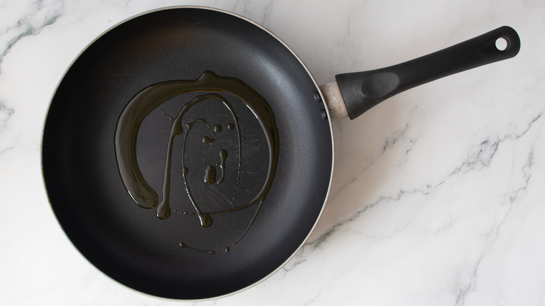 oil in a black frying pan