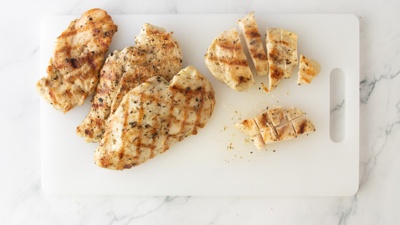 cooked chicken on a cutting board