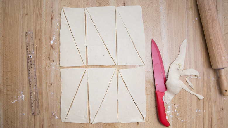 triangular pieces of croissant dough