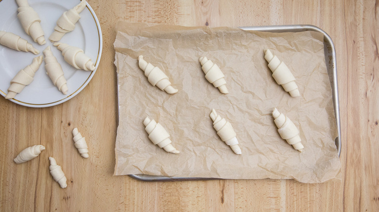 unbaked croissants on table