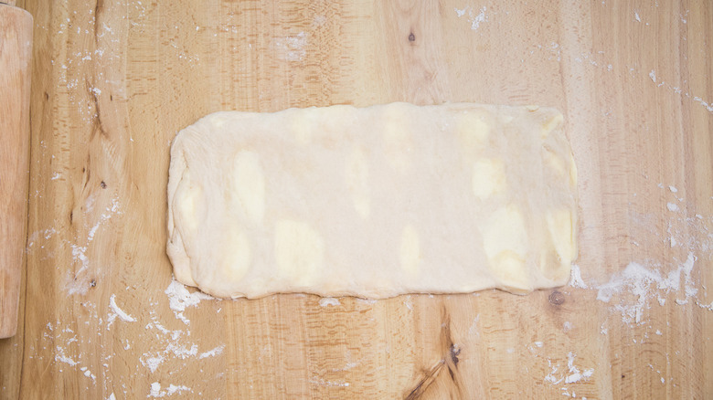dough rolled out on table