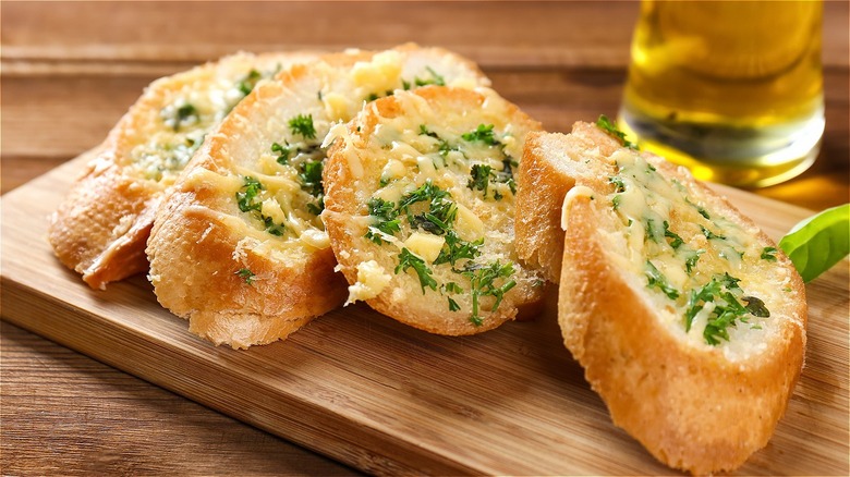 garlic bread on wooden board