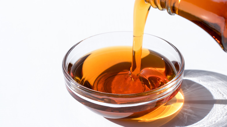 Pouring maple syrup in a bowl