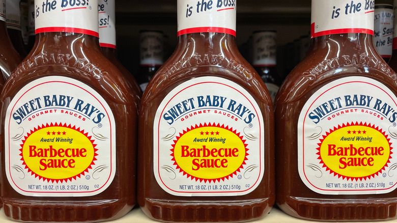 Sweet Baby Ray's barbecue sauce bottles on a grocery store shelf