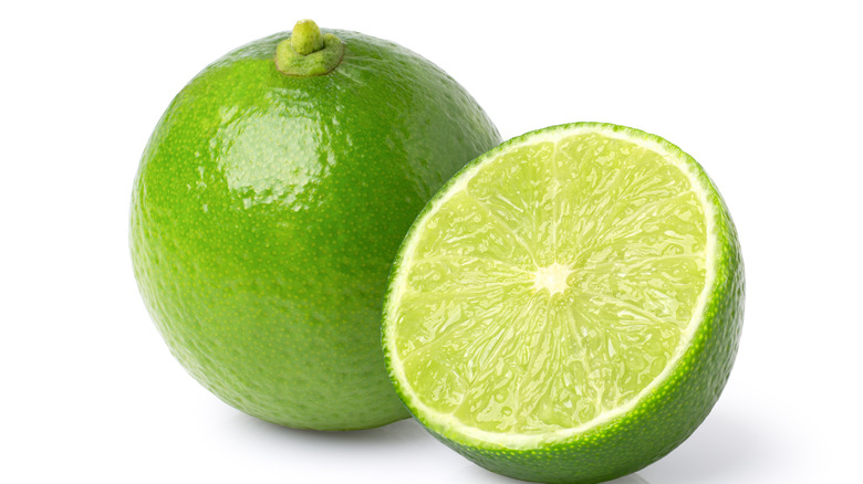 Full lime with a half sliced lime