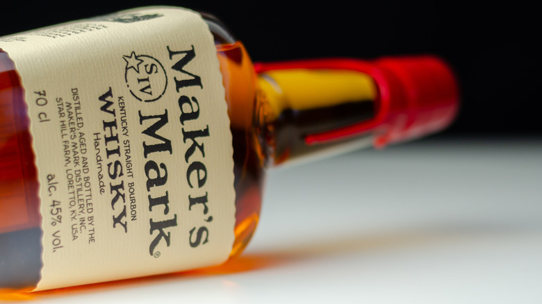 A bottle of Maker's Mark on its side at an angle