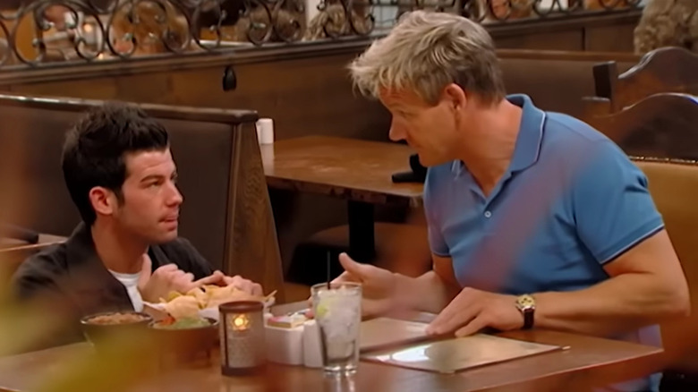 Gordon Ramsay speaks with a waiter at Mama Rita's restaurant on "Kitchen Nightmares"