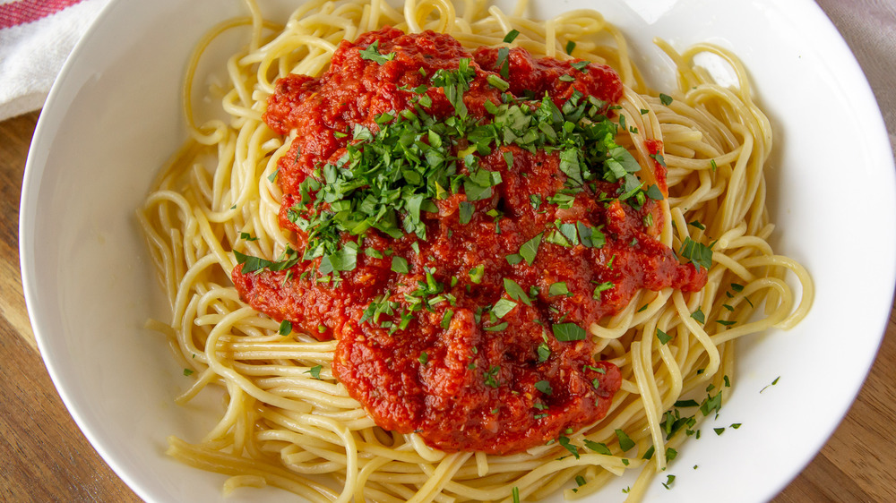 plate of spaghetti with marinara sauce