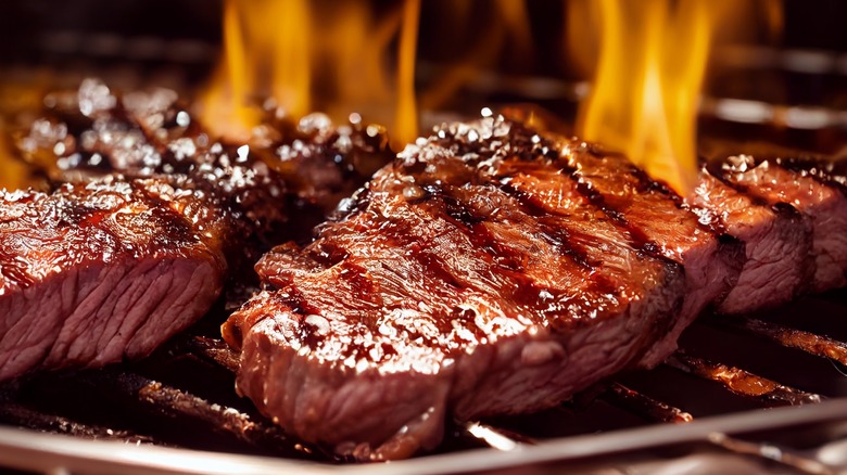 steaks on a grill