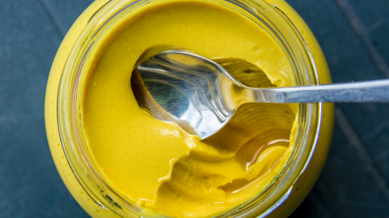 Yellow mustard in a jar