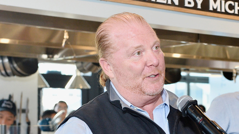 Photo of Mario talking into mic