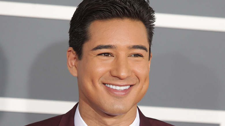 Mario Lopez smiling for press